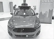  ?? NATHAN BOMEY, USA TODAY ?? Uber is currently restrictin­g drivership of its Ford Fusion self-driving car to its own trained employees.