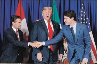  ?? TOM BRENNER
NYT ?? Mexican president Enrique Peña Nieto, whose term ended Friday,, U.S. President Donald Trump and Prime Minister Justin Trudeau signed the trade deal intended to replace the North American Free Trade Agreement.