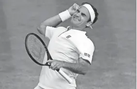  ??  ?? Roger Federer celebrates his win over Rafael Nadal in their semifinal at Wimbledon on Friday. ANDREW COULDRIDGE/EPA-EFE