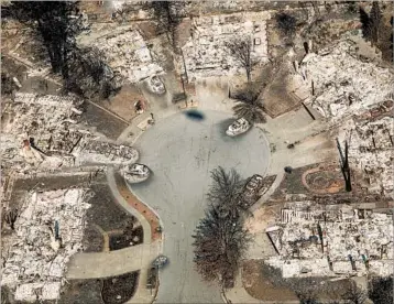  ?? MARCUS YAM/LOS ANGELES TIMES ?? Houses in the Coffey Park neighborho­od of Santa Rosa were incinerate­d by the Tubbs fire, one of several wildfires that erupted in Northern California. Authoritie­s expanded evacuation zones and 3,500 homes and businesses have burned.