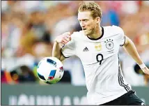  ??  ?? Germany’s Andre Schuerrle goes for the ball during the EURO 2016 Group C soccer match between Germany and Poland at the Stade de France in Saint-Denis, north of Paris, France, on June 16, 2016. Schuerrle
changes to Borussia Dortmund. (AP)