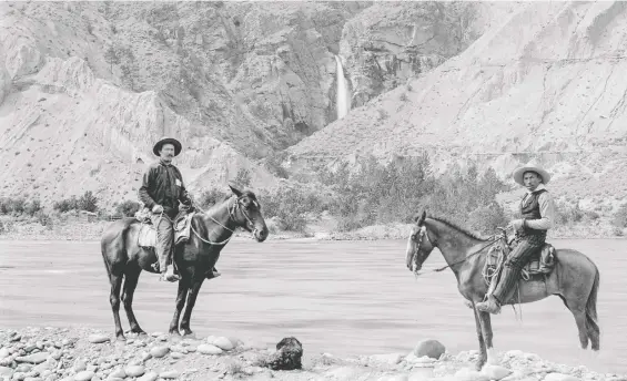  ?? CITY OF VANCOUVER ARCHIVES ?? James Teit, left, and his Nlaka’pamux friend, George Ta-magh-kyn, travel circa 1890 on the south bank of the Thompson River, across from Murray Falls.