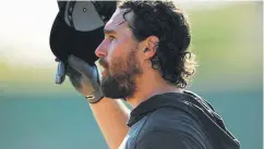  ??  ?? The Rockies’ Daniel Murphy watches batting practice during spring training at Salt River Field at Talking Stick last week.