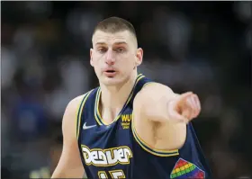  ?? DAVID ZALUBOWSKI - THE ASSOCIATED PRESS ?? Denver Nuggets center Nikola Jokic gestures after hitting a 3-point basket against the Golden State Warriors in the first half of Game 4of an NBA basketball first-round Western Conference playoff series Sunday, April 24, 2022, in Denver.