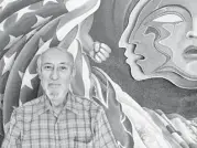  ?? Molly Glentzer / Houston Chronicle ?? Now 75, Tanguma shows off the center section of his 64-foot mural “The Torch of Quetzalcoa­tl,” which he keeps in his garage in Arvada, Colo.