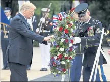  ?? EVAN VUCCI — THE ASSOCIATED PRESS ?? President Donald Trump lays a wreath at the Tomb of the Unknown Solider on Monday at Arlington National Cemetery in Arlington, Va.