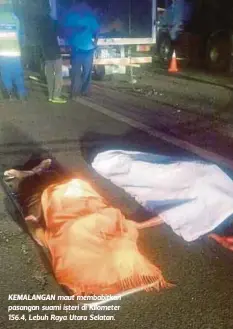  ??  ?? KEMALANGAN maut membabitka­n pasangan suami isteri di Kilometer 156.4, Lebuh Raya Utara Selatan.