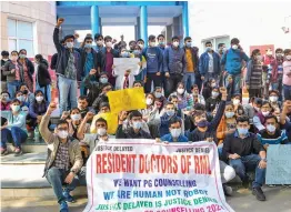  ?? — PTI ?? Resident doctors of Ram Manohar Lohia Hospital raise slogans during a protest in New Delhi on Monday.