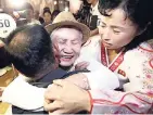  ??  ?? South Korean Lee Keum-seom (centre), 92, hugs her North Korean son Ri Sang Chol, 71, with Kim Ok Hu i (left), daughter-in-law of Ri Sang Chol, during the Separated Family Reunion Meeting in North Korea on Monday.