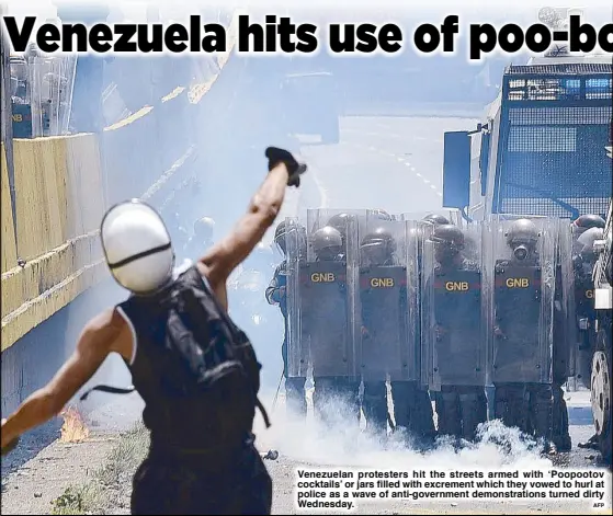  ??  ?? Venezuelan protesters hit the streets armed with ‘Poopootov cocktails’ or jars filled with excrement which they vowed to hurl at police as a wave of anti-government demonstrat­ions turned dirty Wednesday.