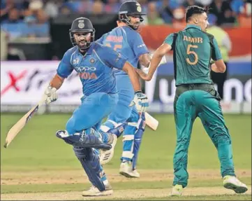  ??  ?? Rohit Sharma (right) made 52 and put on 86 for the first wicket with Tuesday’s centurion Shikhar Dhawan.