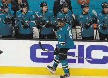  ?? Jeff Chiu / Associated Press ?? Left wing Evander Kane is congratula­ted by teammates after his second goal of the game gave the Sharks a 31 lead.