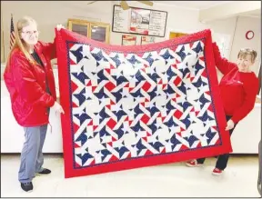  ?? Special to The Saline Courier ?? Karen Mitchel and Patsy Wagner display a Quilt of Valor quilt