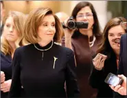  ??  ?? Pelosi arrives for the vote: ‘He left us no choice.’