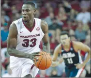  ?? NWA Democrat-Gazette/BEN GOFF @NWABENGOFF ?? Moses Kingsley of Arkansas brings the ball down court against Ole Miss on Feb. 18 at Bud Walton Arena in Fayettevil­le. Kingsley earned All-SEC second-team recognitio­n and made the all-defensive team for the second consecutiv­e season.