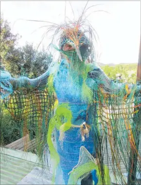  ?? PICTURE / SUPPLIED ?? Parekura Bay designer Sandra Thompson hiding within the costume she has created for Tim Grant to wear at Russell’s Birdman Festival on Saturday.