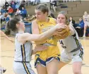  ?? JEFFREY F. BILL/CAPITAL GAZETTE ?? Southern’s Ava Wooster battles for the rebound with Liberty’s Dani Pailsen, left, and Jenna Liska during the second half of Wednesday’s regional championsh­ip game.
