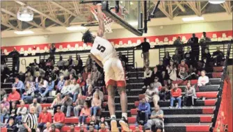  ?? / Contribute­d by Gail Conner ?? Jayden Johnson’s dunk against Sandy Creek made a statement in the team’s last regular season home game for the 2018-19 season.