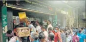  ?? AFP ?? People queue up to buy alcohol after the state announced a 15-day partial lockdown, in Siliguri on Saturday.