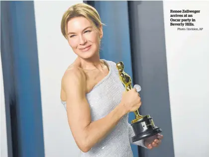  ?? Photo / Invision, AP ?? Renee Zellweger arrives at an Oscar party in Beverly Hills.