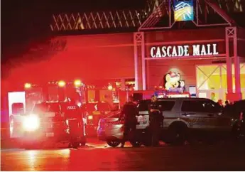  ?? AP ?? Police at the crime scene outside the Cascade Mall in Burlington, Washington, where several people were fatally shot on Friday. At least one suspect is at large.