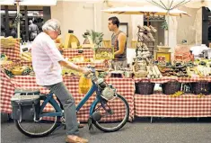  ??  ?? The wheels have come off: even a French boulangeri­e stall in a market in Arles can’t halt the French decline