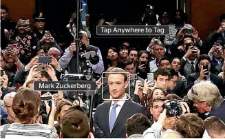  ?? DIGITALLY ALTERED IMAGE/GETTY ?? Mark Zuckerberg’s appearance before a Senate committee was a circus, but the questionin­g must continue. Tap Anywhere to Tag Mark Zuckerberg