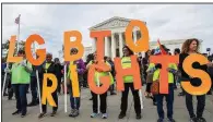  ?? AP/MANUEL BALCE CENETA ?? Gay-rights advocates rally Tuesday in front of the Supreme Court building.