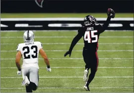  ?? JOHN BAZEMORE — THE ASSOCIATED PRESS ?? Turnovers like this intercepti­on return for a touchdown by Falcons linebacker Deion Jones (45) last month have been tough for the Raiders to overcome this season.