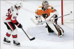  ?? MATT SLOCUM — THE ASSOCIATED PRESS ?? Ottawa Senators defenseman Erik Karlsson scores the game-winning goal in the shootout past Flyers goalie Steve Mason on Tuesday.