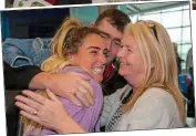  ??  ?? aRRivals: Karen Heavey embraces mum Lorraine and dad David