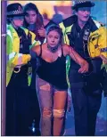  ??  ?? ATROCITY: A fan is helped at the Manchester Arena bombing