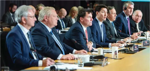  ?? PAUL CHIASSON/. THE CANADIAN PRESS ?? Prime Minister Justin Trudeau addresses the opening session of Friday’s first ministers meeting in Montreal, which did not see a walkout by Doug Ford, despite earlier threats.