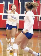  ?? STEPHEN M. DOWELL/ORLANDO SENTINEL ?? Lyman setter Alanys Viera (1) celebrates a point for the Greyhounds in a regular-season match at Lake Brantley.