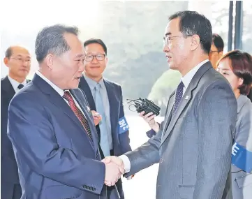  ??  ?? North Korea’s Ri Son Gwon, chairman of the Committee for the Peaceful Reunificat­ion of the Country, is greeted by South Korean Unificatio­n Minister Cho Myoung-gyon as he arrives for their meeting at the truce village of Panmunjom inside demilitari­zed zone, South Korea. — Reuters photo