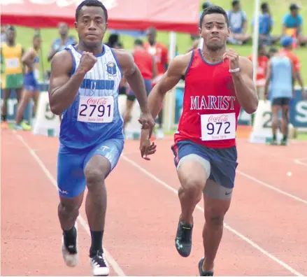  ?? Photo: Ronald Kumar ?? Natabua High School’s favourite Shane Tuvusa (left) beats Anare Lovobalavu of Marist Brothers High School in the senior boys 100m heats during the first day of the Coca- Cola Games at the ANZ Stadium, Suva on April 19, 2018.