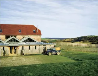  ??  ?? Top The Flint Barns house either seasonal workers or holiday guests. Right The 2015 blanc de noirs, in the contentiou­s 500ml bottle that Mark calls the ‘Sussex pint’