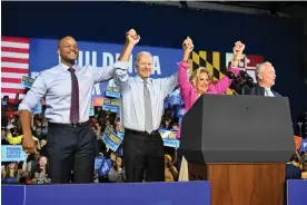  ?? Mandel Ngan/AFP/Getty Images ?? Joe Biden attended a rally in Maryland with Wes Moore, the Democratic gubernator­ial candidate, and Senator Chris Van Hollen on the eve of midterm elections. Photograph: