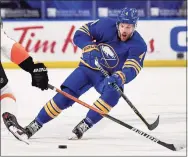  ?? Adrian Kraus / Associated Press ?? The banged-up Boston Bruins are getting a boost for their late-season playoff push by acquiring forward Taylor Hall in a trade with the Buffalo Sabres on Monday.