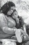  ?? Lynsey Addario / New York Times ?? Keilyn Enamorada Matute of Honduras and her son surrender to Border Patrol agents after crossing the Rio Grande into McAllen. Some deterrence is unavoidabl­e in any immigratio­n system.