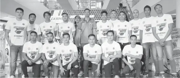  ?? PAUL JUN E. ROSAROSO ?? The members of the Cebu City Sharks led by their head coach Gilbert Castillo pose during their formal launching yesterday at Robinsons Fuente Activity Center.