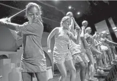  ?? DILL/SPECIAL TO THE COMMERCIAL APPEAL BRANDON ?? Oct. 31, 2013: Dressed as golden sports trophies, advisory students of Alejandra Lejwa including Taylor Kinard, 18, from left, and Gaby Nair take the stage at Hutchison High School to compete in the costume competitio­n during the school’s Halloween parade. Girls from the early childhood classes to upper school students participat­ed in the showcase.