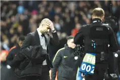  ??  ?? Manchester City’s Spanish manager Pep Guardiola leaves the pitch at half-time during the UEFA Champions League Round of 16 first-leg football match between Manchester City and Monaco at the Etihad Stadium in Manchester, north west England on February...