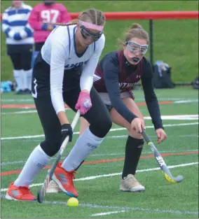  ??  ?? Camden midfielder Greta Kwiakowski fends off a Port Byron defender during a 5-0Blue Devil victory over Class D champion Port Byron.