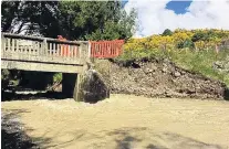  ?? PHOTO: CENTRAL OTAGO DISTRICT COUNCIL ?? Flood damage . . . Bridge 94, which crosses Station Creek on the St Bathans Loop Rd, is seen on Thursday last week. The bridge is completely closed because last week’s floodwater­s undermined part of it. A permanent barricade has been erected to make the bridge inaccessib­le. The closure applies to vehicle traffic, cyclists and pedestrian­s.