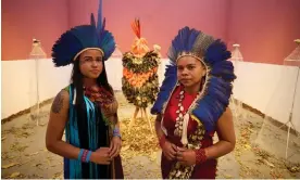  ?? Photograph: David Levene/The Guardian ?? Glicéria Tupinambá (right, with her niece Jessica) in the Brazilian pavilion at Venice, which features the Tupinambá cloak, along with letters asking for its return.