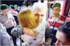  ?? YASIN AKGUL/AFP ?? Turkish cartoonist Musa Kart of thehugs his wife after being freed from Silivri prison on July 28 in Istanbul.