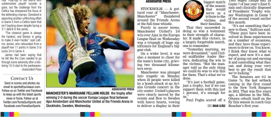  ?? ASSOCIATED PRESS ?? MANCHESTER’S MAROUANE FELLAINI HOLDS the trophy after winning 2-0 during the soccer Europa League final between Ajax Amsterdam and Manchester United at the Friends Arena in Stockholm, Sweden, Wednesday.