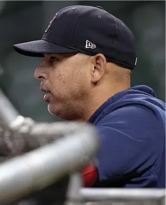  ?? Ap; left, Matt StOne / Herald Staff file ?? OLD FRIENDS: Red Sox manager Alex Cora watches batting practice before Game 6 of the ALCS against the Houston Astros on Friday. Before the game, Cora spoke to Ron Roenicke, seen at left, who replaced Cora as Sox manager last year.