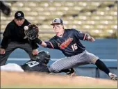  ?? Nick Agro For The Times ?? CYPRESS’ Brett Wozniak goes for tag on a pickoff.